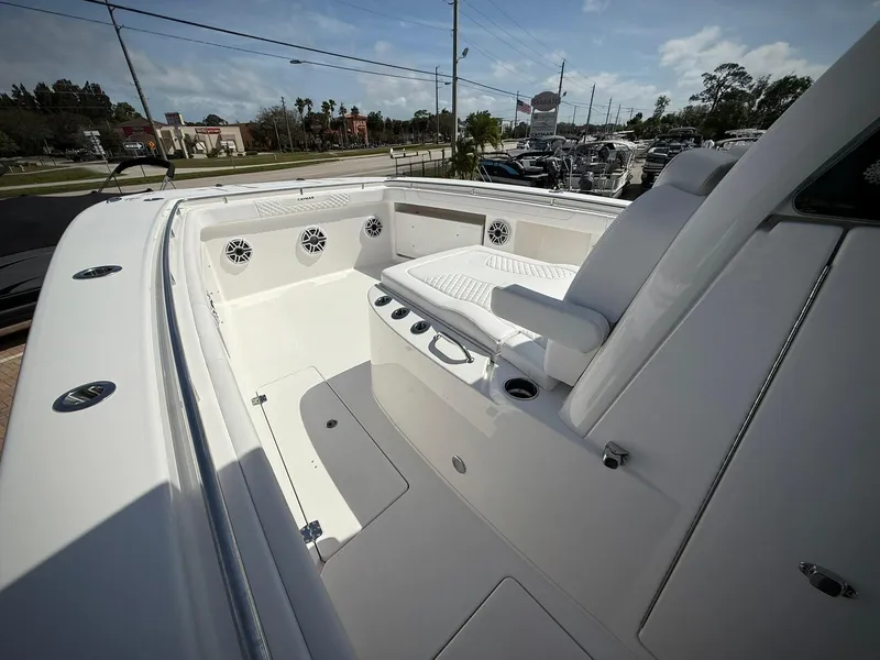 Slide: The Image of 2025 Caymas 34 CT boat interior with seating and speakers, showcasing modern design. - 22