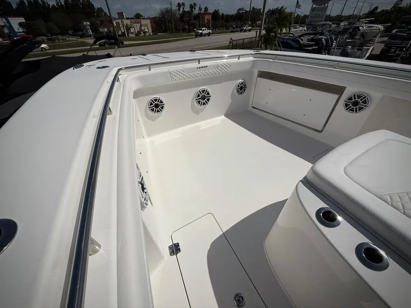 Slide: The Image of 2025 Caymas 34 CT boat interior with seating and speakers. - 25