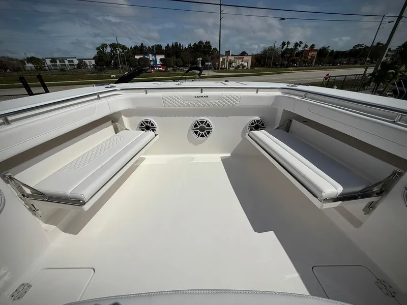 Slide: The Image of 2025 Caymas 34 CT boat interior with white seating and speakers. - 27