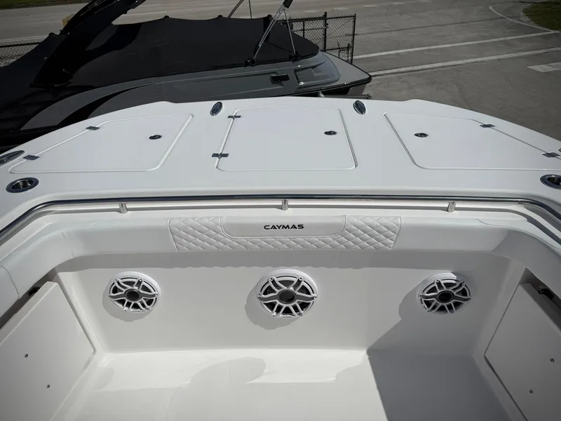 Slide: The Image of 2025 Caymas 34 CT boat interior with speakers and storage compartments. - 28