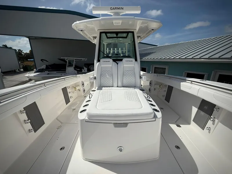 Slide: The Image of 2025 Caymas 34 CT boat interior with cushioned seating and modern design. - 31