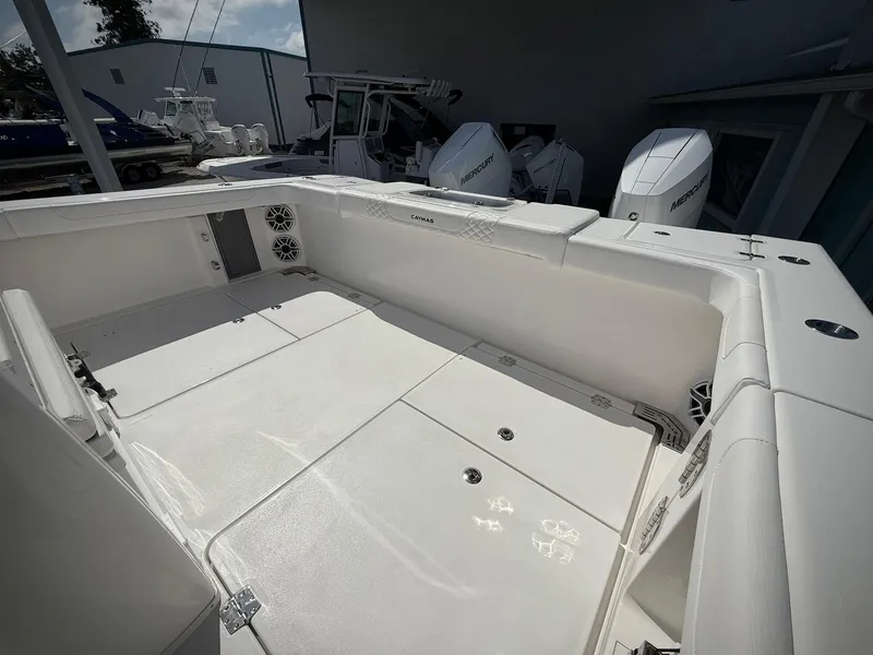 Slide: The Image of 2025 Caymas 34 CT boat deck with spacious seating and storage compartments. - 7