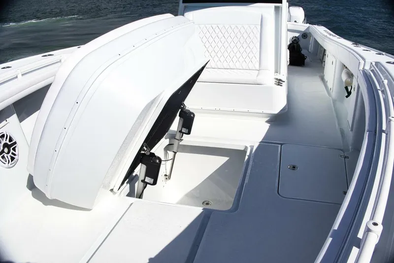Slide: The Image of 2023 Yellowfin 39 Offshore boat deck with open storage compartment. - 21