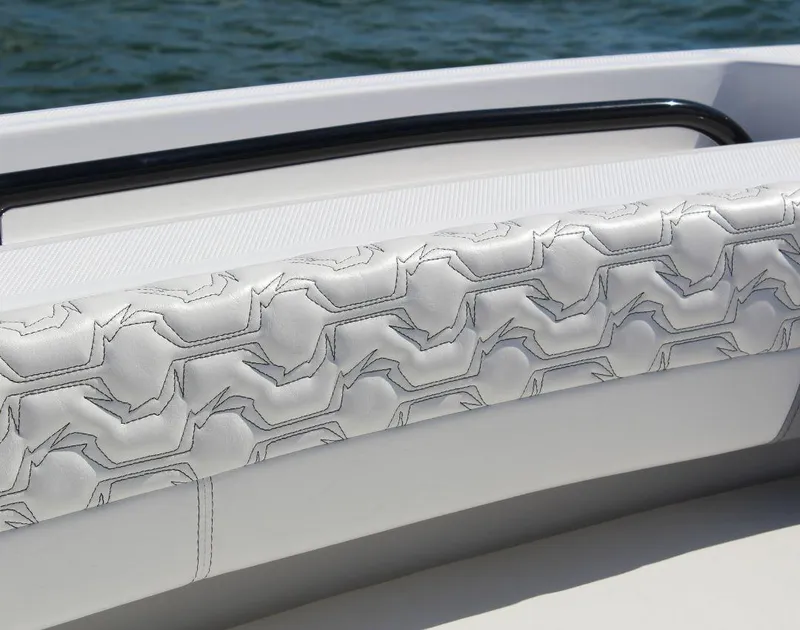 Slide: The Image of Luxury seating detail on 2025 Fountain 32 NX boat, featuring intricate stitching design. - 13
