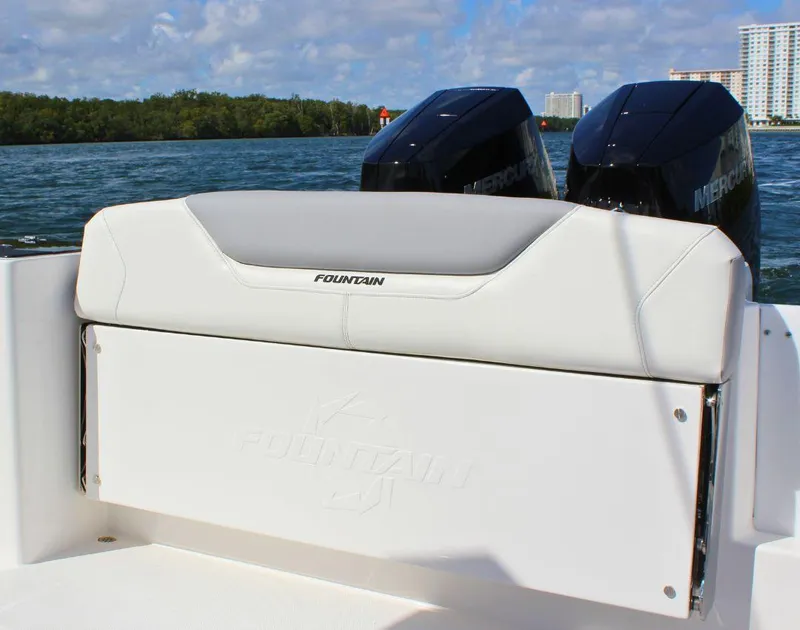 Slide: The Image of 2025 Fountain 32 NX boat with dual Mercury engines on a sunny day. - 20