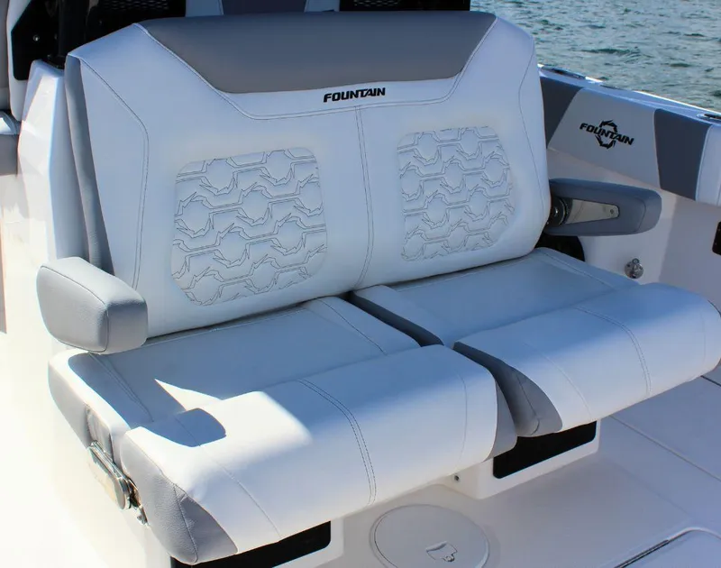 Slide: The Image of 2025 Fountain 32 NX boat seats with elegant white upholstery and embossed design. - 24