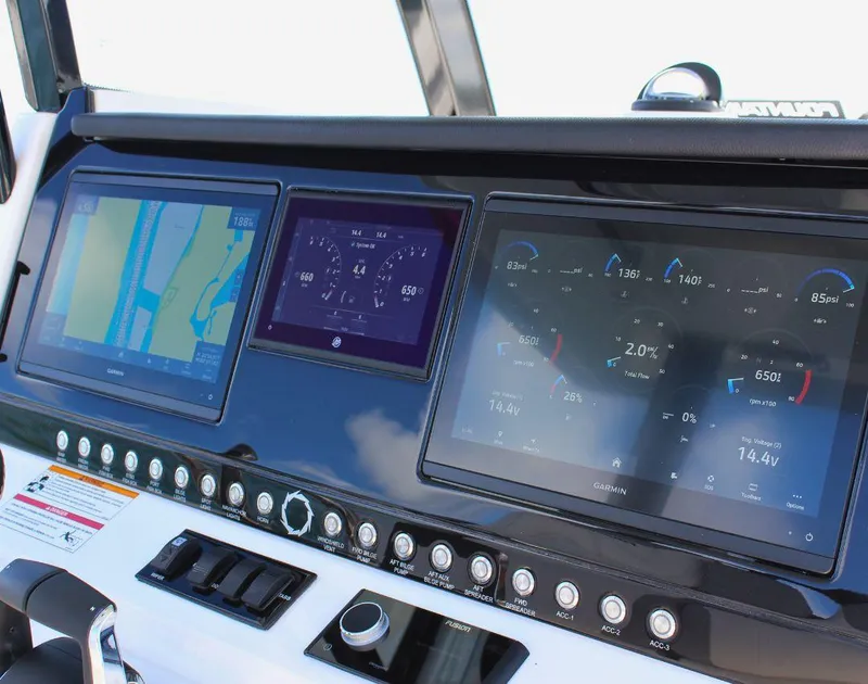 Slide: The Image of Dashboard of 2025 Fountain 32 NX boat with navigation and control screens. - 31