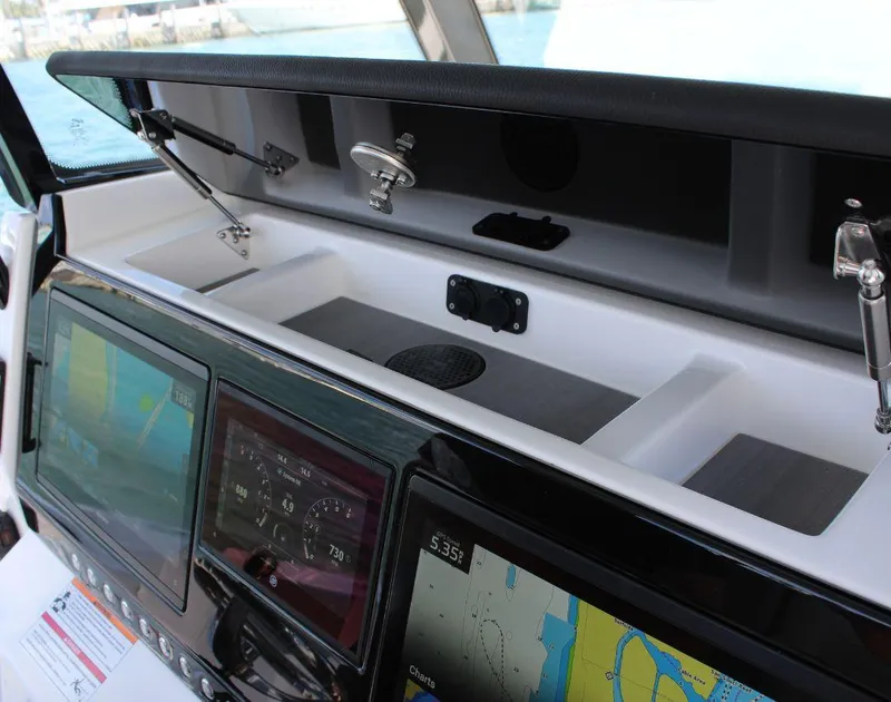 Slide: The Image of Dashboard of 2025 Fountain 32 NX boat with advanced navigation displays. - 33