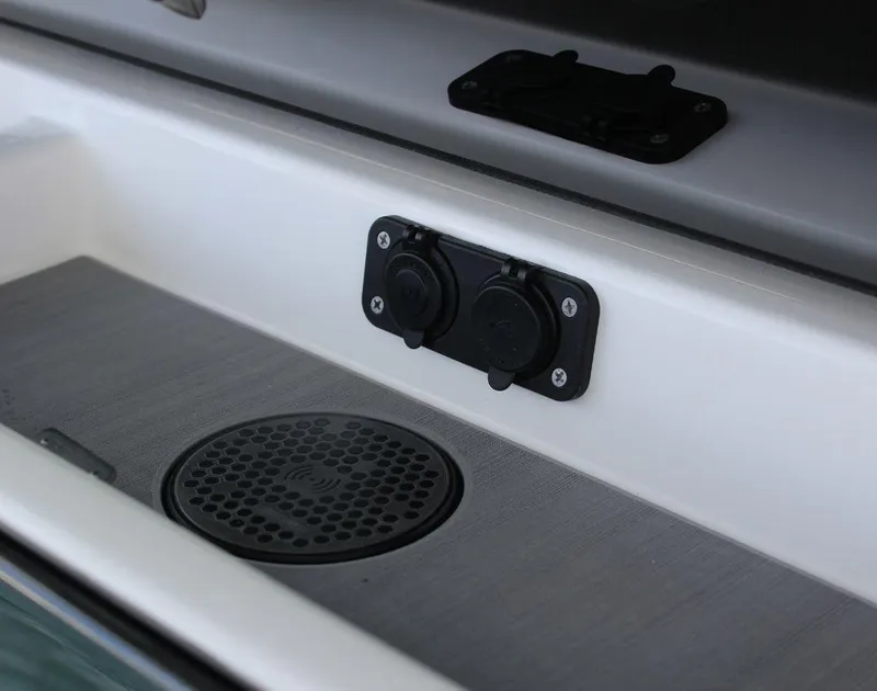 Slide: The Image of 2025 Fountain 32 NX boat interior detail with speaker and dual socket panel. - 34