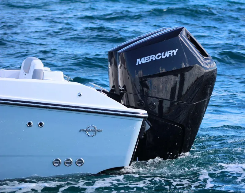 Slide: The Image of 2025 Fountain 32 NX boat with Mercury outboard engine on the water. - 6