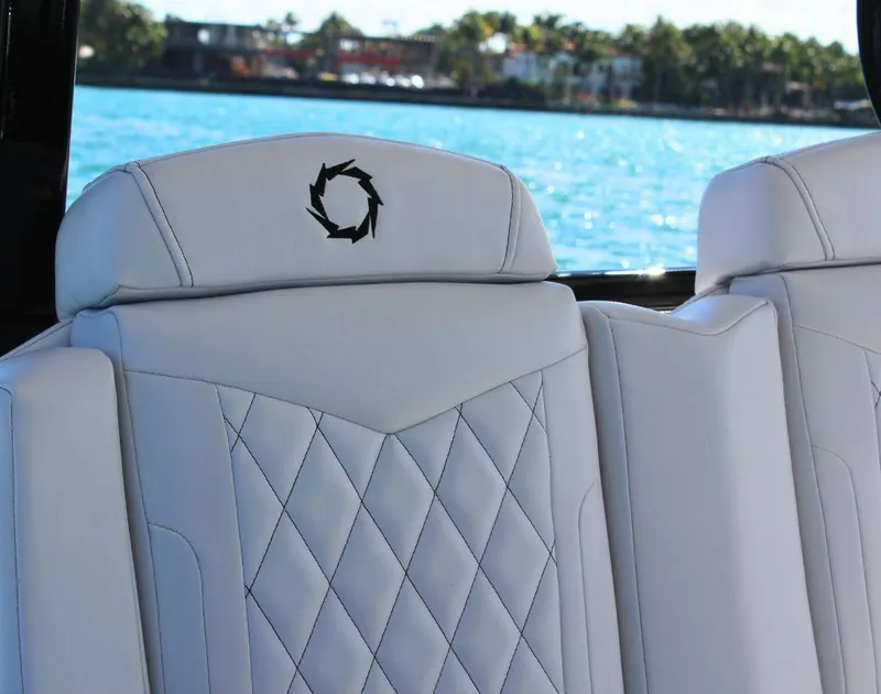 Slide: The Image of Luxury seating on 2025 Fountain 38 CC boat with elegant stitching and logo. - 15