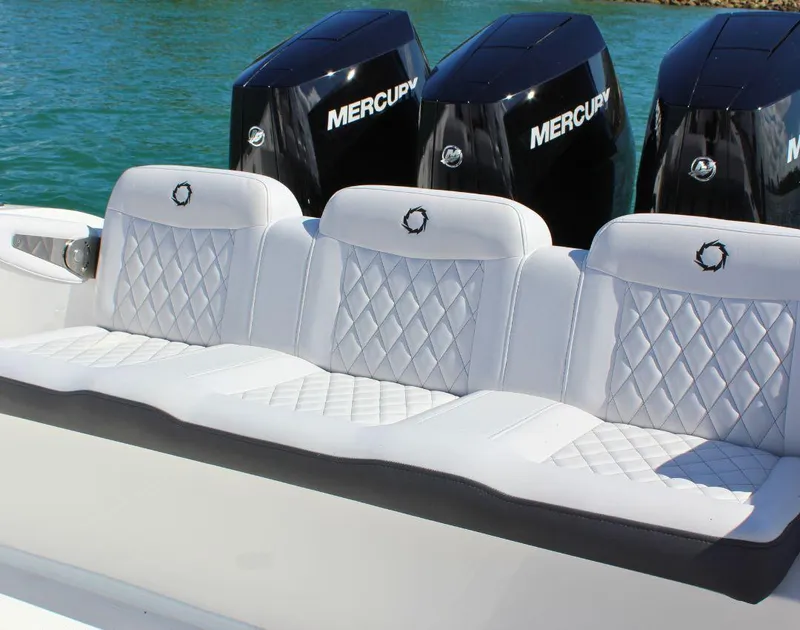 Slide: The Image of Luxury seating on 2025 Fountain 38 CC boat with Mercury engines in background. - 5