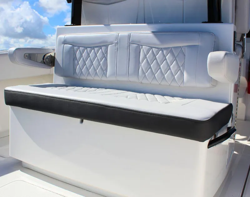 Slide: The Image of Luxury seating on 2025 Fountain 38 CC boat, featuring diamond-stitched upholstery. - 6