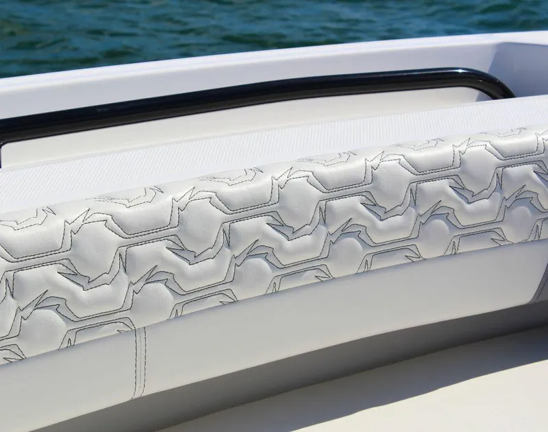 Slide: The Image of 2025 Fountain 38 CC boat interior with stylish patterned upholstery, close-up view. - 9