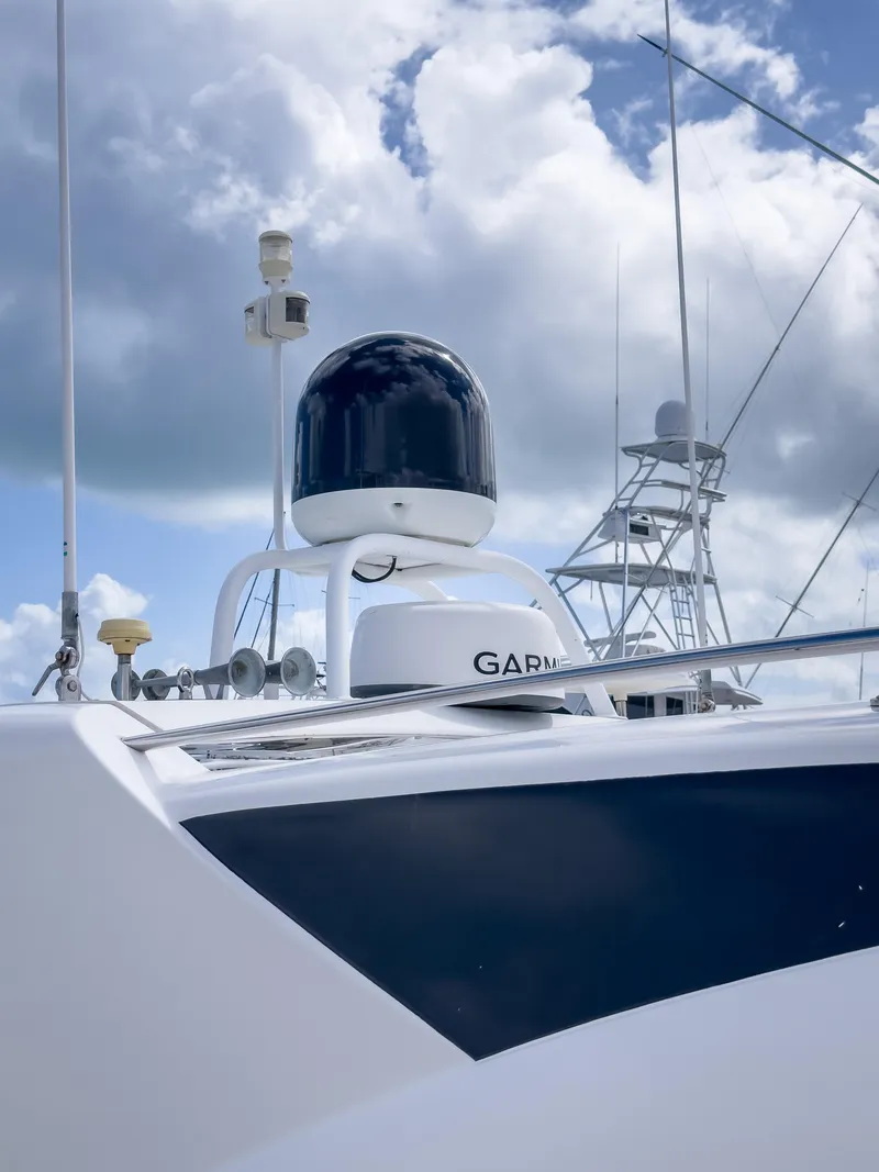 Slide: The Image of 2012 Riviera 50SY yacht with Garmin equipment against a cloudy sky. - 18