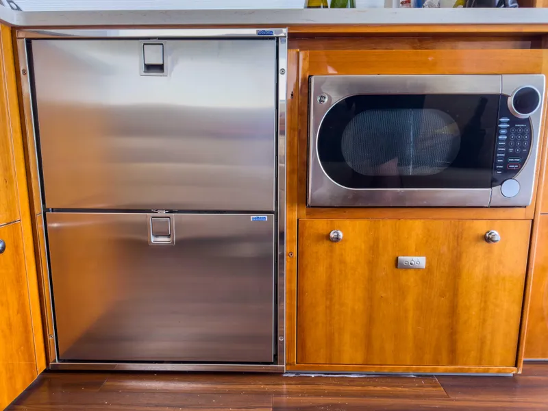 Slide: The Image of Stainless steel fridge and microwave in 2012 Riviera 50SY yacht kitchen. - 5