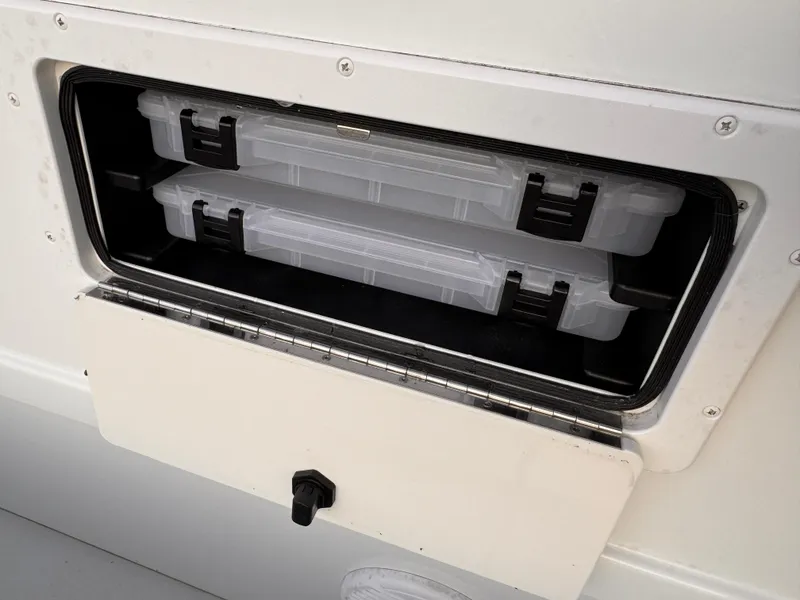 Slide: The Image of Storage compartment on 2017 Parker 1801 Center Console boat with tackle boxes. - 17