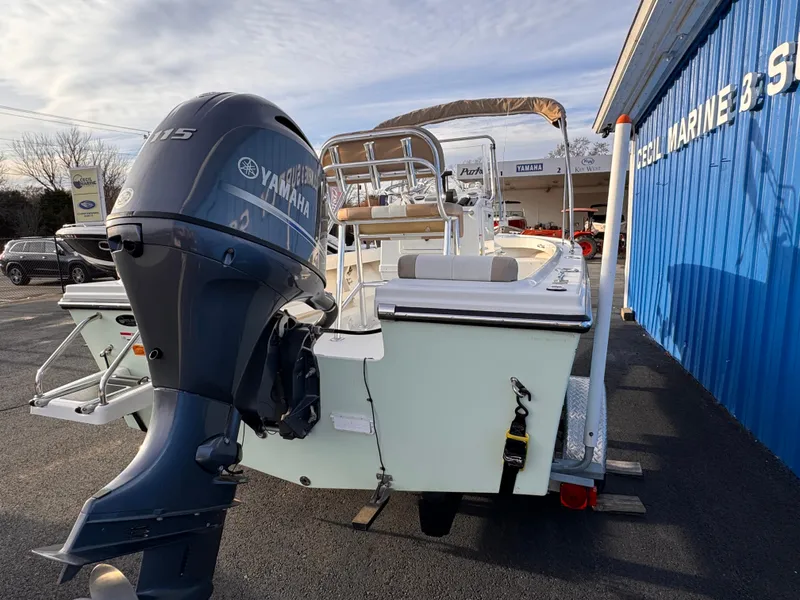 Slide: The Image of 2017 Parker 1801 Center Console boat with Yamaha outboard motor at a marine dealership. - 20