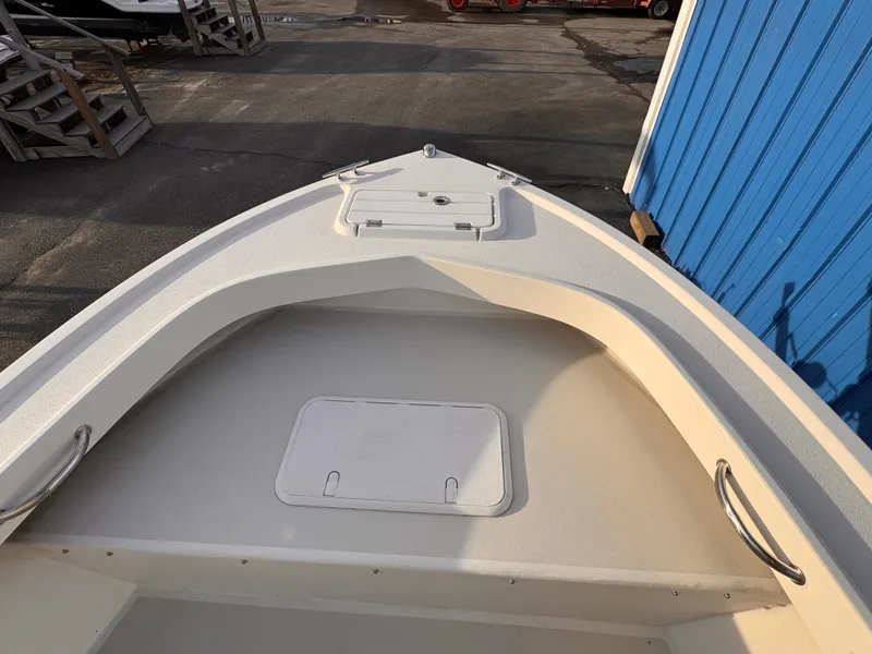 Slide: The Image of 2017 Parker 1801 Center Console boat bow, featuring storage compartments and stainless steel handrails. - 22