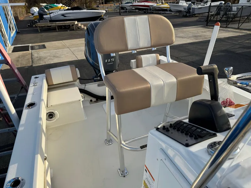 Slide: The Image of 2017 Parker 1801 Center Console boat with beige seating and Yamaha 115 engine. - 24