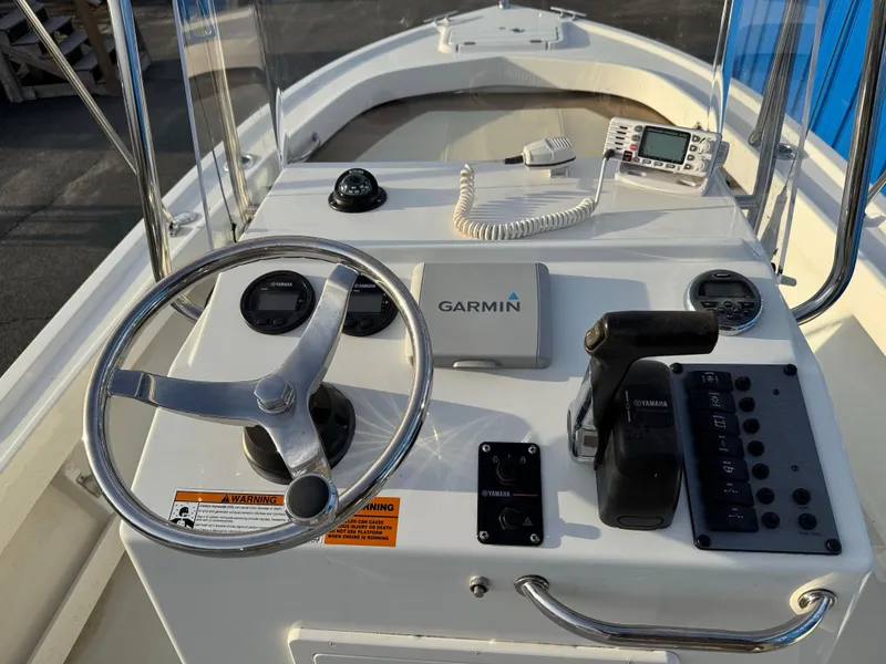 Slide: The Image of 2017 Parker 1801 Center Console boat dashboard with Garmin navigation system. - 25