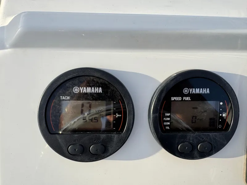 Slide: The Image of Yamaha tachometer and speed fuel gauges on a 2017 Parker 1801 Center Console boat. - 26
