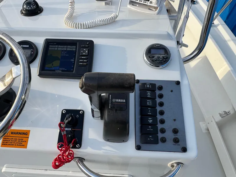 Slide: The Image of Control panel of a 2017 Parker 1801 Center Console boat with Yamaha throttle. - 4