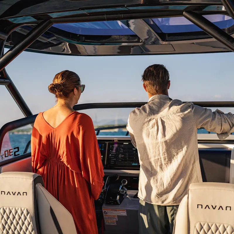 Slide: The Image of Couple enjoying a ride on a 2025 Navan C30 boat, sunny day. - 1
