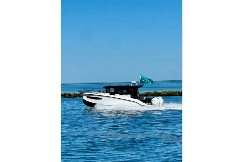 Slide: The Image of Navan C30 2025 boat cruising on blue ocean with clear sky background. - 12