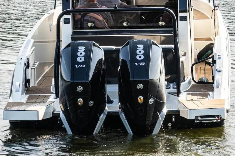 Slide: The Image of 2025 Navan C30 boat with dual 300 V8 Mercury outboard engines on water. - 13