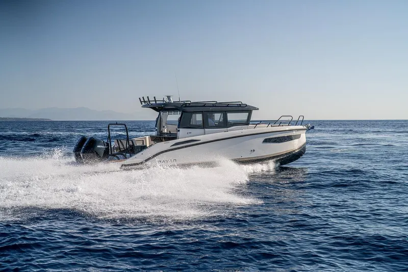 Slide: The Image of Overhead view of 2025 Navan C30 boat docked, illuminated by blue underwater lights. - 15