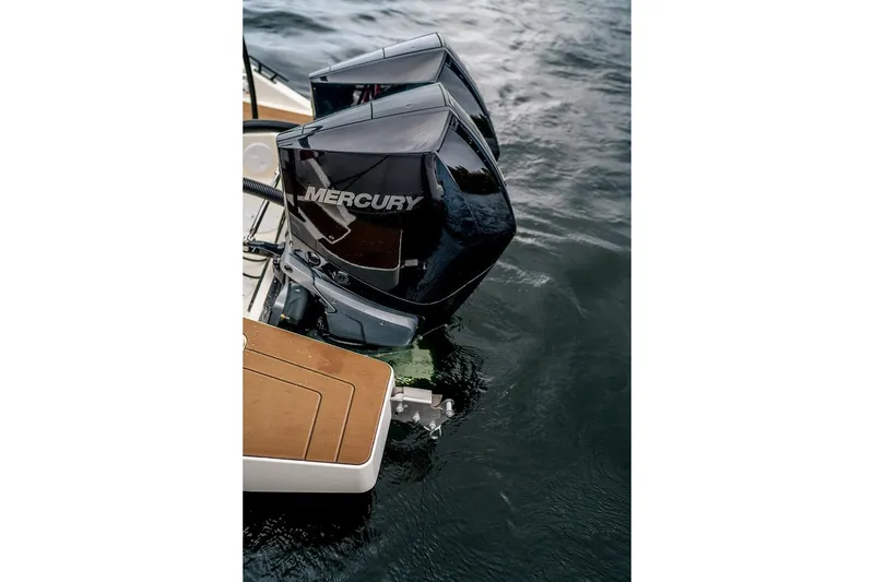 Slide: The Image of Family enjoying outdoor cooking on Navan C30 boat, 2025 model, by the water. - 20