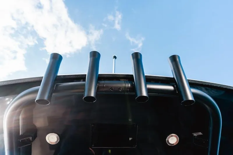 Slide: The Image of Navan C30 boat with Mercury Verado engines near rocky coastline, 2025 model. - 23