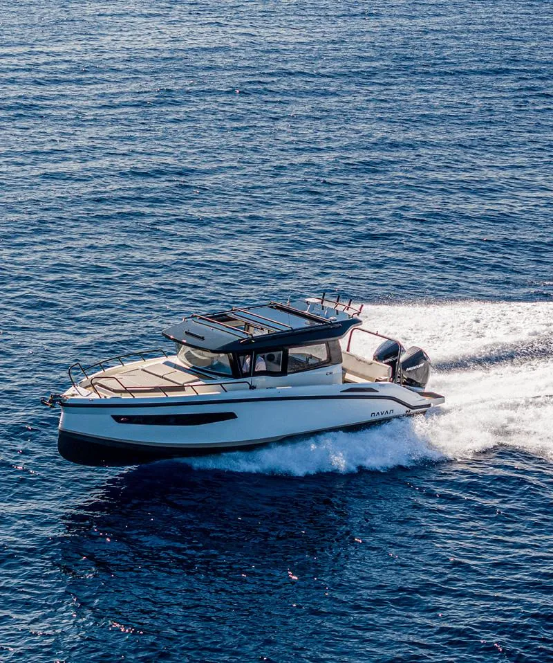 Slide: The Image of 2025 Navan C30 boat cruising on open sea under clear blue sky. - 5