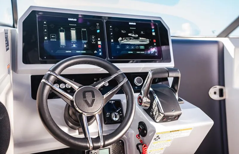 Slide: The Image of Helm of 2025 Navan C30 boat with advanced digital displays and controls. - 8