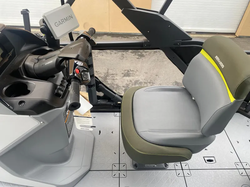 Slide: The Image of 2025 Sea-Doo Switch Fish 18 cockpit with Garmin navigation and comfortable seating. - 14