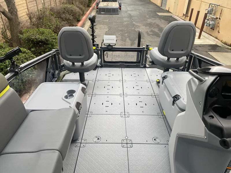 Slide: The Image of 2025 Sea-Doo Switch Fish 18 interior with seating and control panel, showcasing spacious layout. - 15