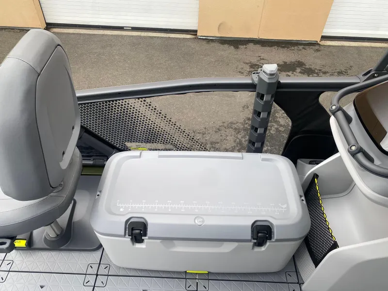 Slide: The Image of 2025 Sea-Doo Switch Fish 18 interior with seating and storage compartment. - 17