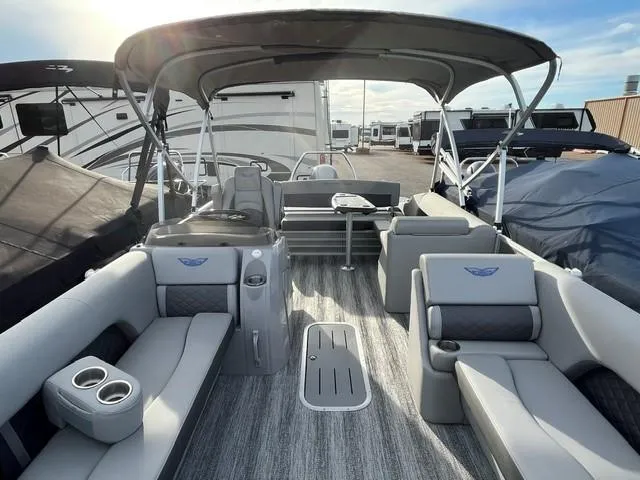 Slide: The Image of 2025 Bennington 21L SB pontoon boat interior with seating and canopy. - 13