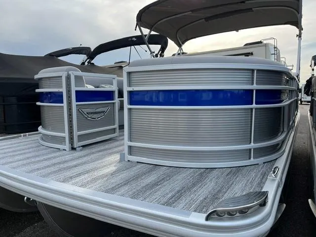 Slide: The Image of 2025 Bennington 21L SB pontoon boat with sleek design and blue accent. - 3