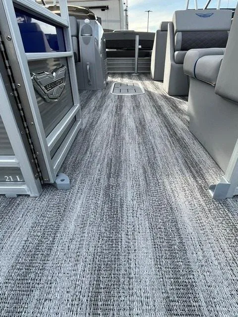 Slide: The Image of 2025 Bennington 21L SB pontoon boat interior with modern seating and textured flooring. - 5