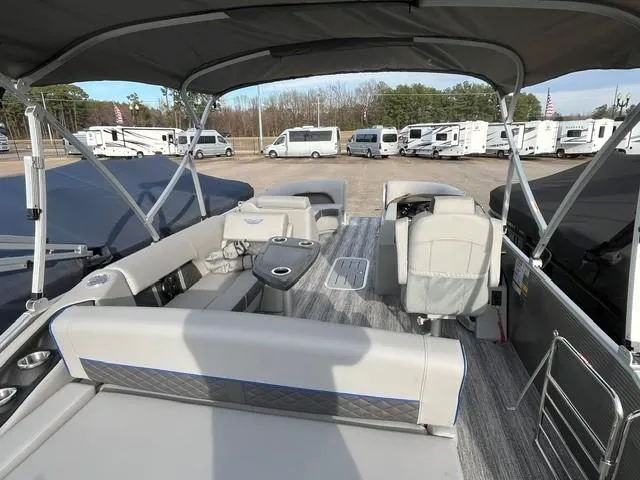 Slide: The Image of 2025 Bennington 21L SB pontoon boat interior with seating and canopy. - 8