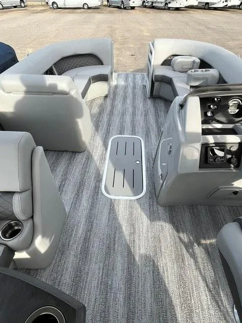 Slide: The Image of 2025 Bennington 21L SB pontoon boat interior with gray seating and modern dashboard. - 9