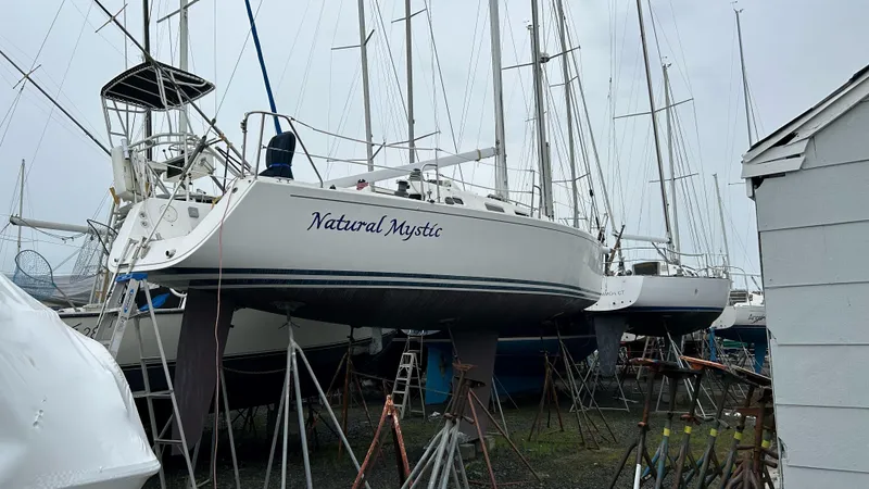 Slide: The Image of 2003 J Boats J/109 sailboat "Natural Mystic" on stands in a boatyard. - 6