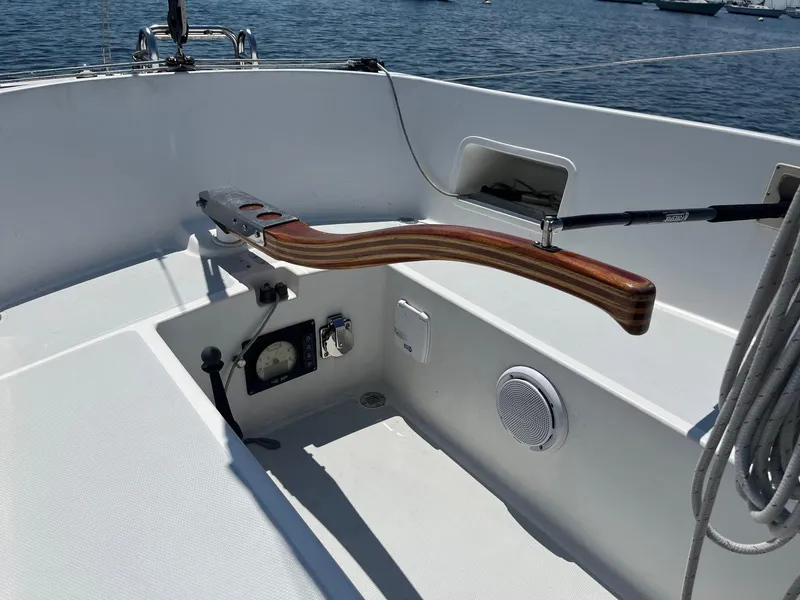 Slide: The Image of Cockpit of 2012 Schock Harbor 25 sailboat with wooden tiller and nautical equipment. - 10