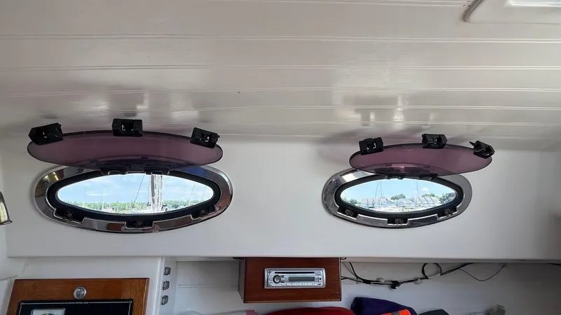 Slide: The Image of Interior view of 2012 Schock Harbor 25 sailboat with open portholes. - 22