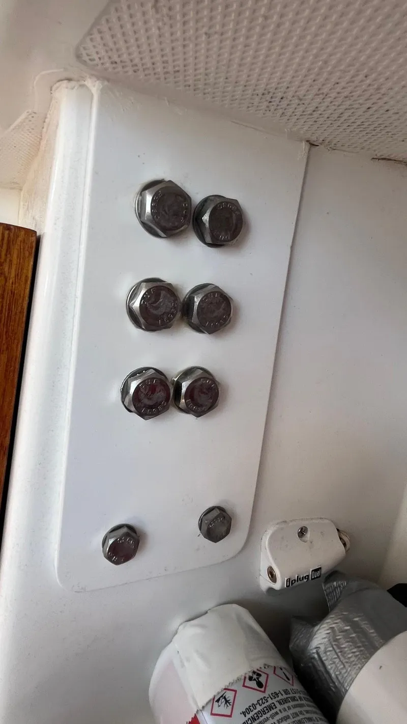 Slide: The Image of Close-up of bolts on a 2012 Schock Harbor 25 sailboat interior. - 23