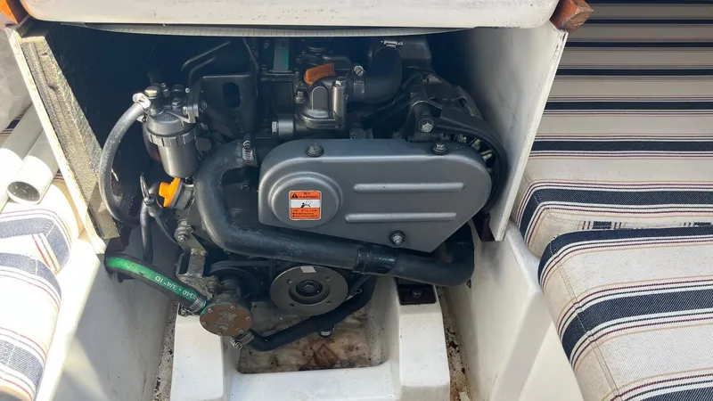 Slide: The Image of 2012 Schock Harbor 25 engine compartment with striped seating. - 25