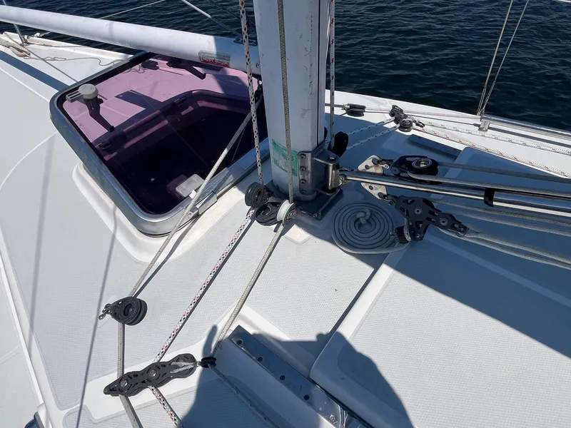 Slide: The Image of Deck of 2012 Schock Harbor 25 sailboat with rigging and open hatch. - 4