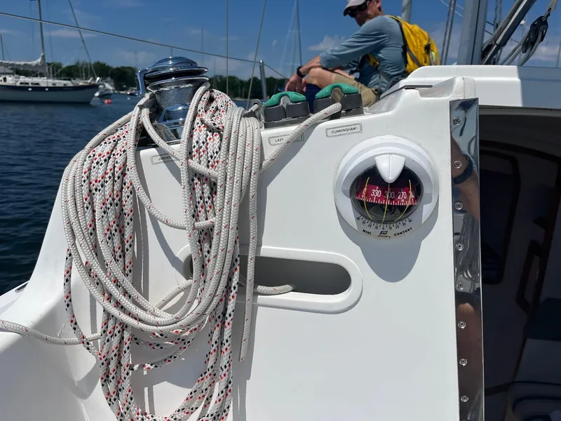 Slide: The Image of Sailboat cockpit with ropes and compass, Schock Harbor 25, 2012 model. - 9